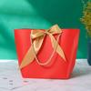 Bolsa de papel con lazo al por mayor, versión horizontal, bolsa de regalo portátil, grande y pequeña, bolsa de embalaje para ropa estilo ins
