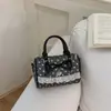 Bolsa Boston fofa estilo coreano com laço, bolsa de mão de bolinhas de nicho, moderna e na moda, bolsa de ombro fresca e doce