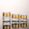 En stock botella de vidrio esmerilado color crema muestra cosmética botella de recarga de viaje tapa acrílica transparente botella de crema sellada para viaje