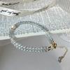 Qiaoen cristal natural muy fino 3.5mm pulsera de luz de luna gris para mujer temperamento de lujo ligero perla de agua dulce feldspato de tiro al por mayor