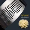 Bestseller transfronterizo en stock: Prensa de ajo manual de acero inoxidable de grado alimenticio con múltiples agujeros, multifuncional y segura para las manos