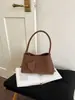 Bolso de axila tejido de nicho estilo francés, nuevo modelo 2026, moderno y elegante, de alta gama, simple, a la moda, de un solo hombro, versátil para comercio exterior