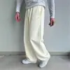 Pantalones de chándal casuales de pierna ancha para pareja con gancho bordado, tela cálida suave y amigable con la piel, diseño simple, que realzan la altura y estilizan