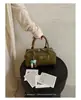 Bolso de mano de diseño de nicho nuevo para comercio transfronterizo, elegante bolso tipo bowling para el hombro y cruzado para el día a día con patrón tejido para mujer
