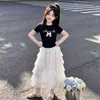 Conjunto de Moda para Niña: Nuevo Conjunto de Dos Piezas de Camiseta Dulce de Verano con Lazo y Manga Corta y Falda de Encaje Tipo Pastel