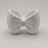 Portacepillos de dientes de corbata de moño bestseller transfronterizo, estante para cepillos de dientes de lavabo, caja de almacenamiento, estante de almacenamiento, diseño de corbata de moño