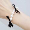 Conjunto de collar y pulsera con lazo de perlas redondas, elegante y a la moda, joyería de nicho sencilla y exquisita.