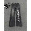 Jeans Lavado Estilo Retrô Americano Afunilado com Estampa de Letras para Homens e Mulheres, Caimento Solto, Design Único de Perna Larga, Realçador de Altura, Comprimento no Chão