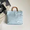 Bolso de mano tejido de lino y bambú transfronterizo nuevo, colección otoño 2026, con estilo chino moderno, diseñado como bolso de noche para mujer