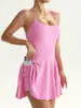 Minifalda de tenis cruzada superventas sexy de una pieza con espalda descubierta para mujer con almohadillas en el pecho, forro anti-exposición, mini falda deportiva de yoga y fitness