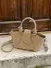 Bolso de mano transfronterizo para mujer 2026 nuevo de alta gama simple versátil plisado de hombro cruzado bolso cubo para ir al trabajo