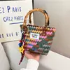 2026 Nuevo Estilo Minimalista Moderno Transfronterizo Hecho a Mano Creativo Mimbre de Imitación Tejido Moda Bolso de Mano para Mujer