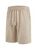 Roupas masculinas transfronteiriças europeias e americanas em estoque: shorts casuais masculinos de verão, de cor sólida, com jacquard, de corte solto, com cordão, e calças de praia