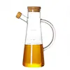 Venta al por mayor de fábrica para el hogar cocina vidrio recipiente para condimentos botella de aceite Boca de águila a prueba de fugas Aceitera de Vidrio de Borosilicato Alto con escala