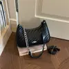 Bolsa de ombro Shuai Mi Jia nicho retrô texturizada 2026 verão nova simples bolsa baguette corrente de ombro pequena quadrada