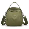 Bolso bandolera de diseño con forma de concha, moderno, de nicho y baja saturación, bolso de hombro de viaje de tela de nailon exquisito y simple para mujer