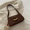 Bolsas de Design de Nicho para Mulheres 2025 Novas Bolsas Femininas Cor Pura Moda Casual Bolsa Baguete Simples Bolsa de Ombro para Axila Tendência