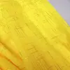 Nuevo tejido de gasa con rayas en relieve dorado y líneas geométricas, adecuado para decoraciones de bodas, cortinas, accesorios y materiales de confección.