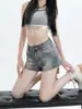 Shorts de mezclilla estilo americano para mujer, verano 2026 nuevos vintage desgastados de cintura alta adelgazantes elásticos de línea A hot pants modernos