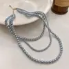 Colar de pérolas multicamadas de ouro da Coreia do Sul, design de nicho de luxo leve, colar de corrente de clavícula de pérolas, joias curtas femininas