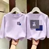 Camiseta de manga larga de algodón puro para niños talla mediana y grande, camiseta básica infantil de estilo coreano moderna y elegante para otoño 2026