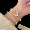 Nova Pulseira Popular de Pedra Olho de Tigre Zircônia Madrepérola Trevo de Quatro Folhas Luxo Leve Quatro Flores Joia de Mão Versátil de Alta Qualidade