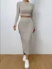 Ropa Europea y Americana 2025 Amazon Primavera Moda Casual Cuello Redondo Manga Larga Falda a la Cadera Traje Tejido