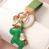 Venta directa de fábrica inmediatamente rico colgante llavero personalidad creativa colgante de cuero llavero para bolso de pareja