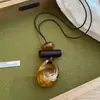 Collar colgante de resina hueca color marrón degradado estilo chino, cadena para suéter estilo vintage, accesorio de lujo ligero de alta gama
