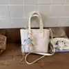 Bolso Cubo Estampado de Dibujos Animados para Mujer 2026 Nueva Moda Bolso de Hombro Cruzado Bolso de Mano Informal Ropa de Trabajo Bolso de Cuadros