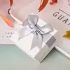 Caja de regalo blanca estilo coreano con moño, disponible para venta al por mayor. Caja de joyería, caja para anillos, collar, aretes, pulsera y otros accesorios.