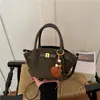 Bolso tipo cubo casual, retro y minimalista con un diseño moderno y único, perfecto como bolso de hombro o cruzado.. Nueva colección 2026, un bolso de nicho para mujer
