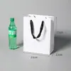 Bolsa de mano simple de cartón blanco, hecha a medida para ropa y regalos, impresión publicitaria universal, logotipo, personalización al por mayor de fábrica