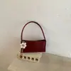 Bolsa de Ombro Baguete 2026 Nova Couro Genuíno Transversal Feminina Design de Nicho Ombro Único Vermelho Bolsa Elegante de Alta Qualidade