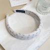 Difícil de convencer a Zhang Ruonan con diadema floral azul para la parte superior alta de la cabeza tocado accesorios para el cabello primavera y verano 2025 nueva belleza dulce