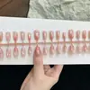 Puntas de Uñas Degradado con Lunares Melocotón, Suaves y Puras, Estilo Chica Dulce, Efecto Iluminador, Adecuadas para el Viaje Diario