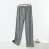 Nuevos pantalones de cuadros para otoño e invierno para mujer, con cintura elástica estilo americano, forro de felpa doblemente cepillado y diseño de pierna ancha, perfectos para uso casual.