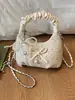 Bolso plisado de diseño único y nicho para mujer, nuevo bolso cruzado de moda 2026, bolso de mano pequeño súper popular, bolso de cuerno