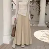 Meia-saia plissada para mulheres, outono/inverno 2026, adequada para corpo tipo pera, cobre os quadris, modeladora, com barra ampla e fluida, saia longa plissada em linha A