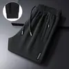 Pantalones deportivos jogger negros de pierna recta para hombre, nuevo estilo de otoño, holgados, a la moda, modernos, adecuados para correr, uso casual y para ir al trabajo.