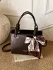 Bolso de Mano de Alta Gama Exquisito de Nicho Retro para Mujer 2026 Nuevo Estilo Coreano de Moda Textura Elegante Bolso Cruzado con Estilo para Dama