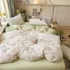 Set súper suave de cuatro piezas de algodón gofrado con estampado floral fresco, adecuado para dormitorio y uso doméstico, incluye sábana bajera y funda de edredón, set floral de tres piezas para exportación