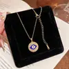 Collar redondo geométrico con colgante de ojo de diablo de diamantes completos de lujo ligero europeo y americano, cadena única y de alta gama para la clavícula, más vendido en ventas transfronterizas