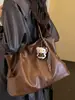 Bolso tote minimalista de nicho Shuai Mi Jia para mujer, nuevo modelo otoño 2026, de gran capacidad, casual, para ir al trabajo, de hombro y debajo del brazo