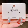 Pendientes de aro de trébol de cuatro hojas con circonita estilo vintage, pendientes dulces de lujo ligero de alta gama populares para mujer