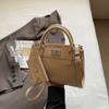 Bolso de mano de alta gama con textura de nicho para mujer, primavera 2025, nuevo bolso de mano para ir al trabajo, moderno bolso bandolera combinable con todo.