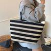Bolso de mano de alta gama de estilo perezoso, de gran capacidad, para mujer, nuevo, bolso de hombro sencillo con huecos y combinable, bolso de compras moderno.