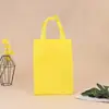 Bolsa de mano con recubrimiento de fabricante de origen en stock al por mayor en blanco para compras ropa bolsa no tejida plegable imprimible logo
