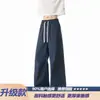 Calça longa masculina de corte oblíquo estilo americano, marca da moda, caimento clean, perna larga solta, calça casual reta, novo modelo 2026
