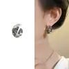 Elegantes pendientes de botón redondos chapados en cobre con un toque de alta gama, diseño de nicho moderno estilo ins, pendientes texturizados, nuevos pendientes versátiles para el día a día
